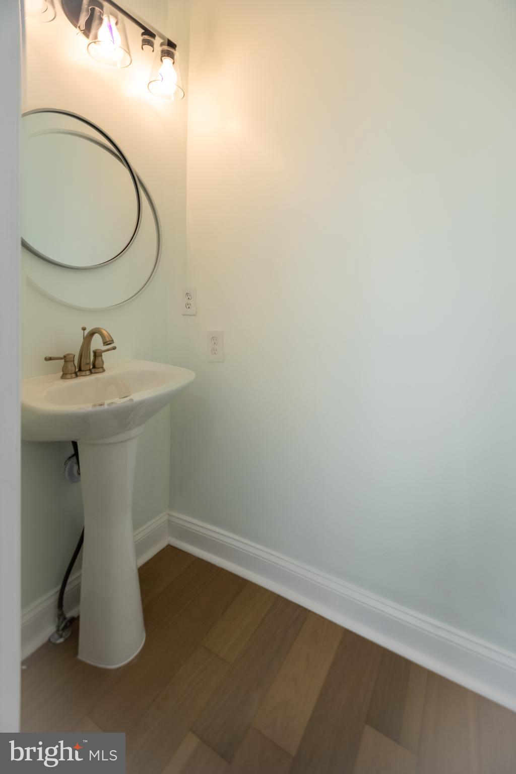 11904 White Heather Road Cockeysville, MD 21030 - Photo 6 of 42 a bathroom with a sink toilet and mirror