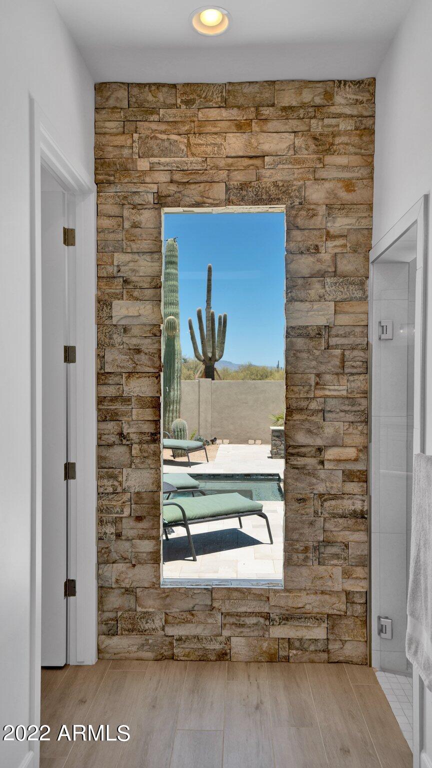 31217 North Ranch Road Cave Creek, AZ 85331 - Photo 39 of 77 Saguaro framed in Primary Bath Window!!
