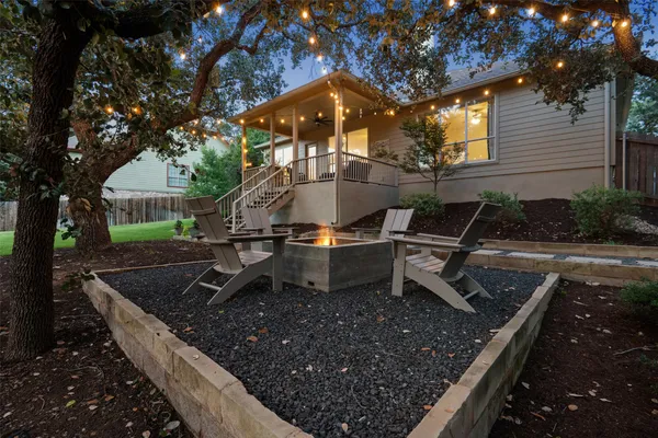 a view of a couches in backyard of house