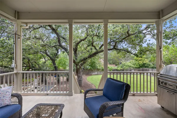 a view of a chair and table in the balcony