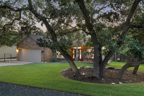 a view of a patio with furniture and a backyard