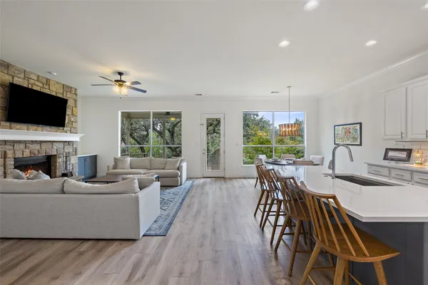 a living room with fireplace furniture and a flat screen tv