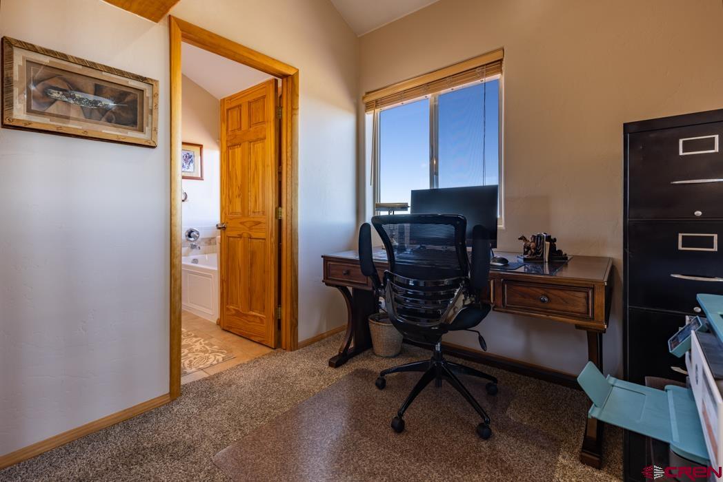 1737 Roberts Ridge Drive Hesperus, CO 81326 - Photo 17 of 34 a view of a workspace with furniture and a window