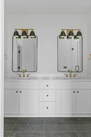 a bathroom with sink mirror and vanity