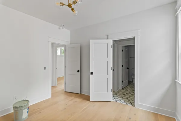 a view of an empty room and bathroom