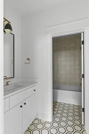 a bathroom with a shower and a sink