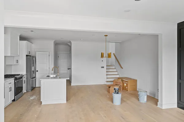 a kitchen with a sink a counter and appliances