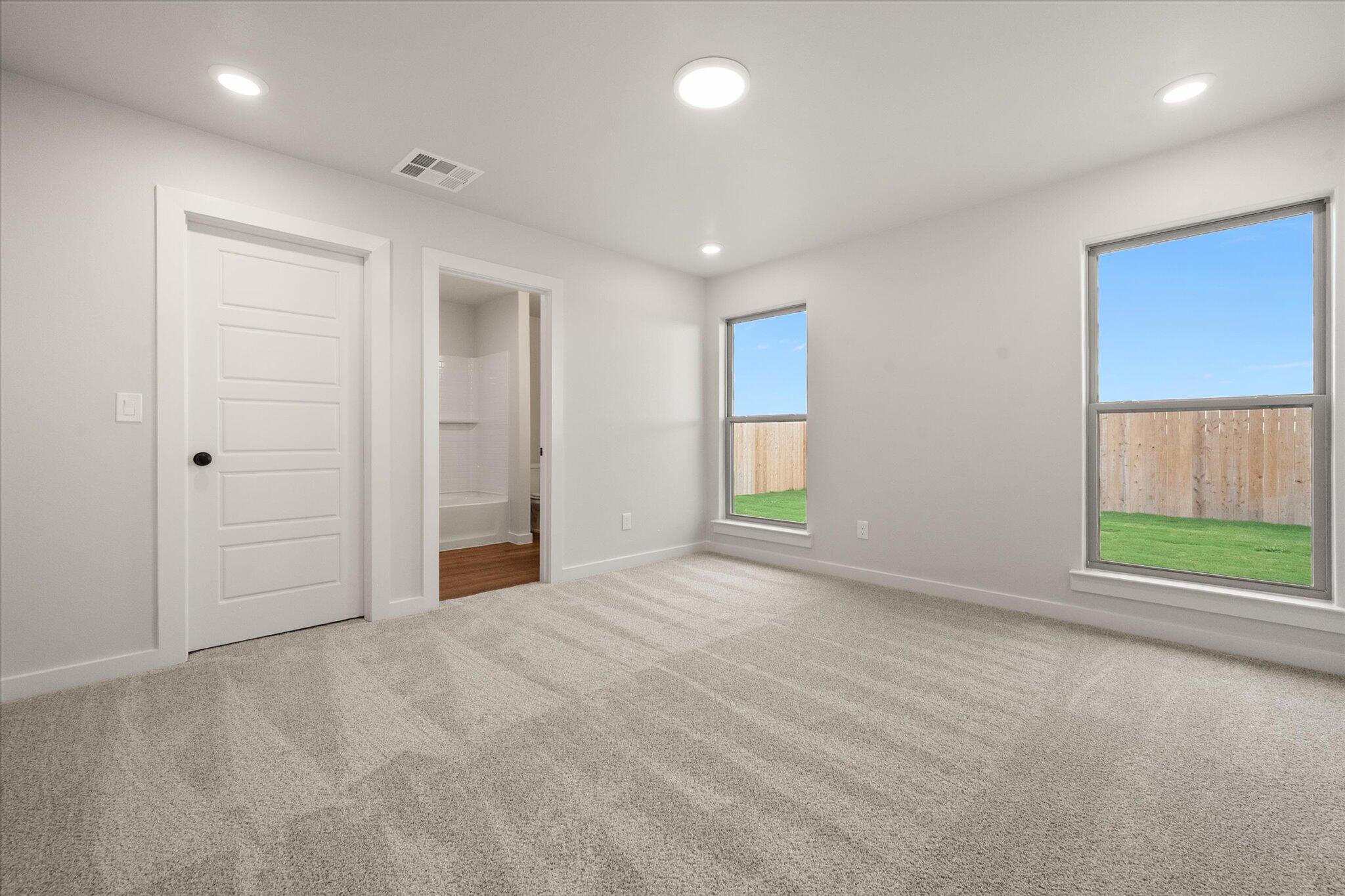 8607 29th Street Lubbock, TX 79407 - Photo 12 of 20 an empty room with windows and closet