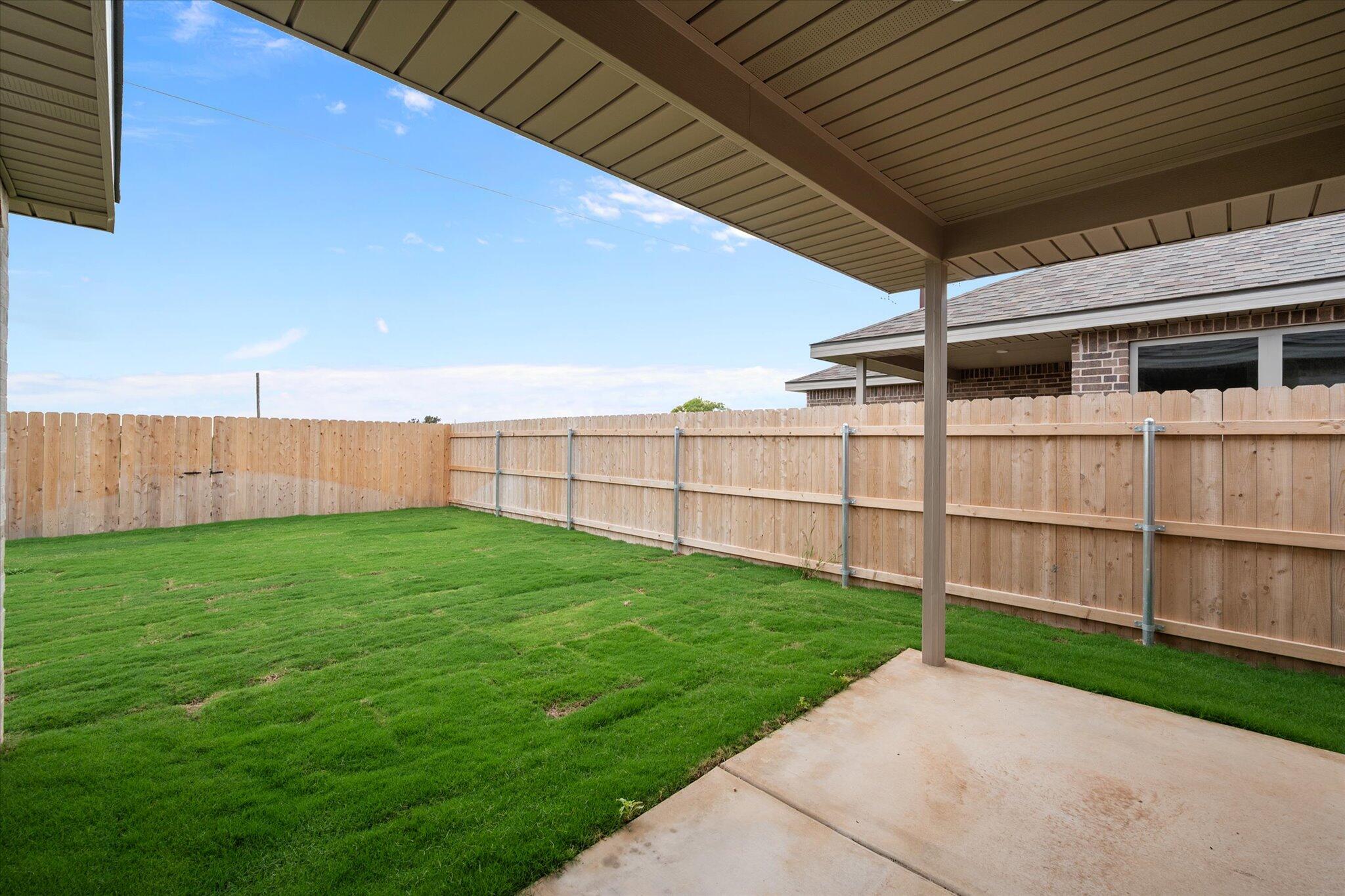 8607 29th Street Lubbock, TX 79407 - Photo 19 of 20 a view of a backyard with a garden
