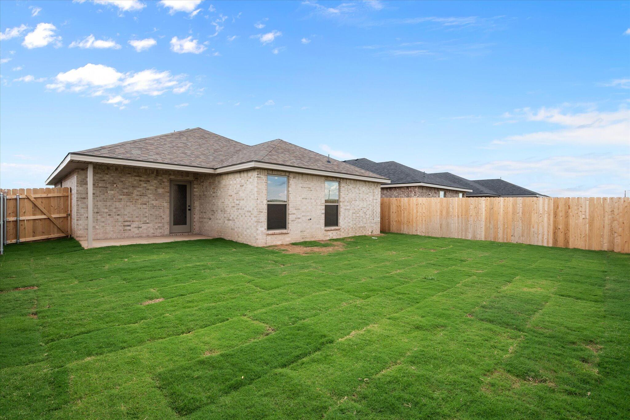 8607 29th Street Lubbock, TX 79407 - Photo 20 of 20 a view of a house with a yard