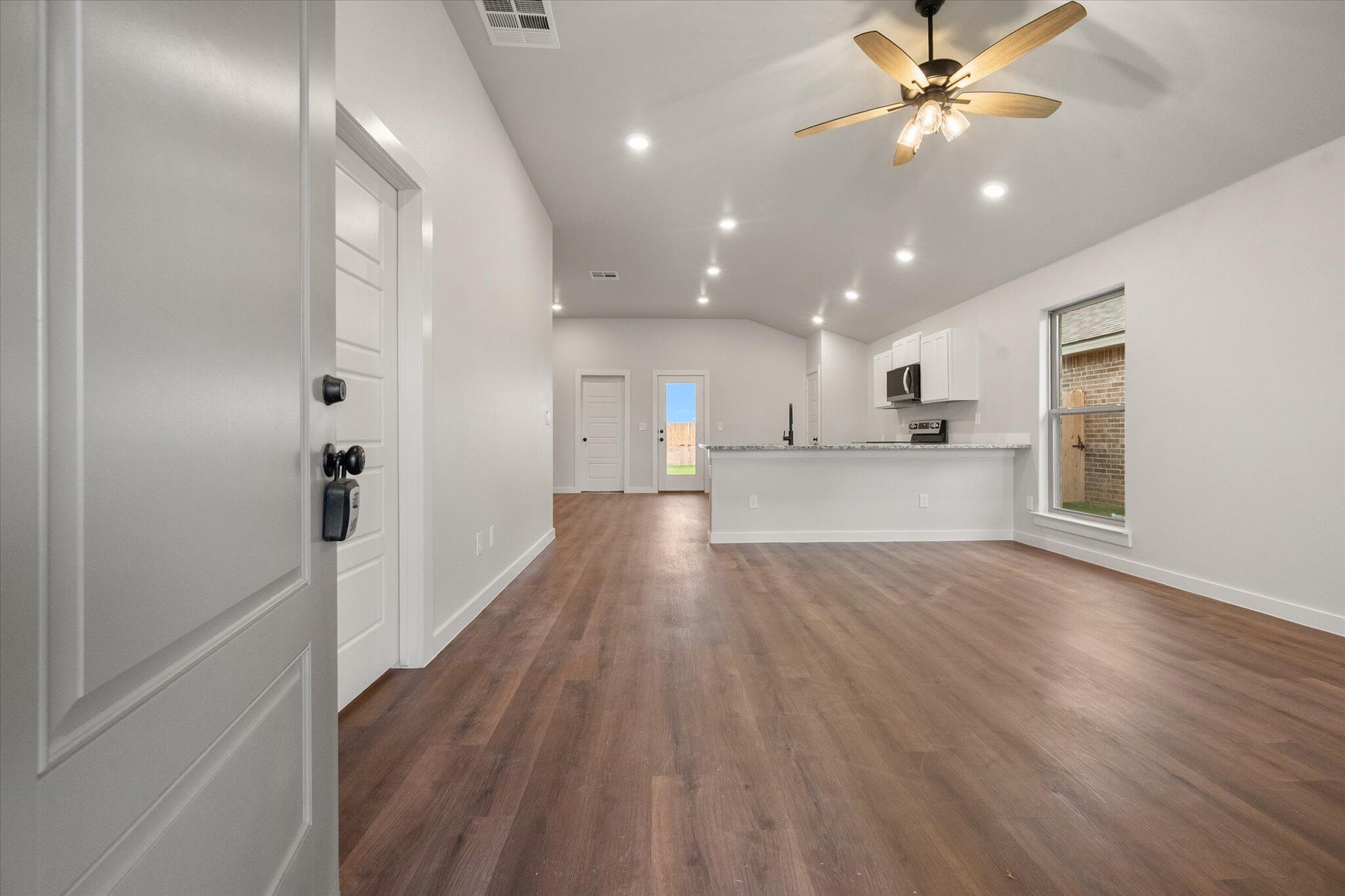 8607 29th Street Lubbock, TX 79407 - Photo 2 of 20 a view of a kitchen with a sink and a window
