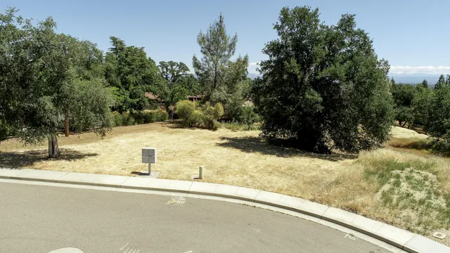 a view of a house with snow on the road