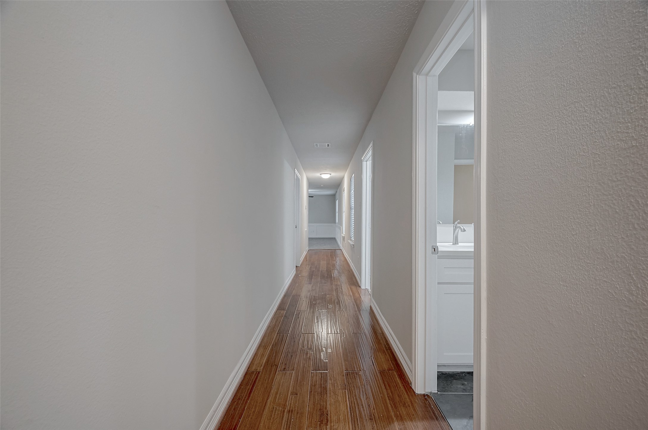 919 Mockingbird Way Sugar Land, TX 77478 - Photo 23 of 41 a view of a hallway with wooden floor