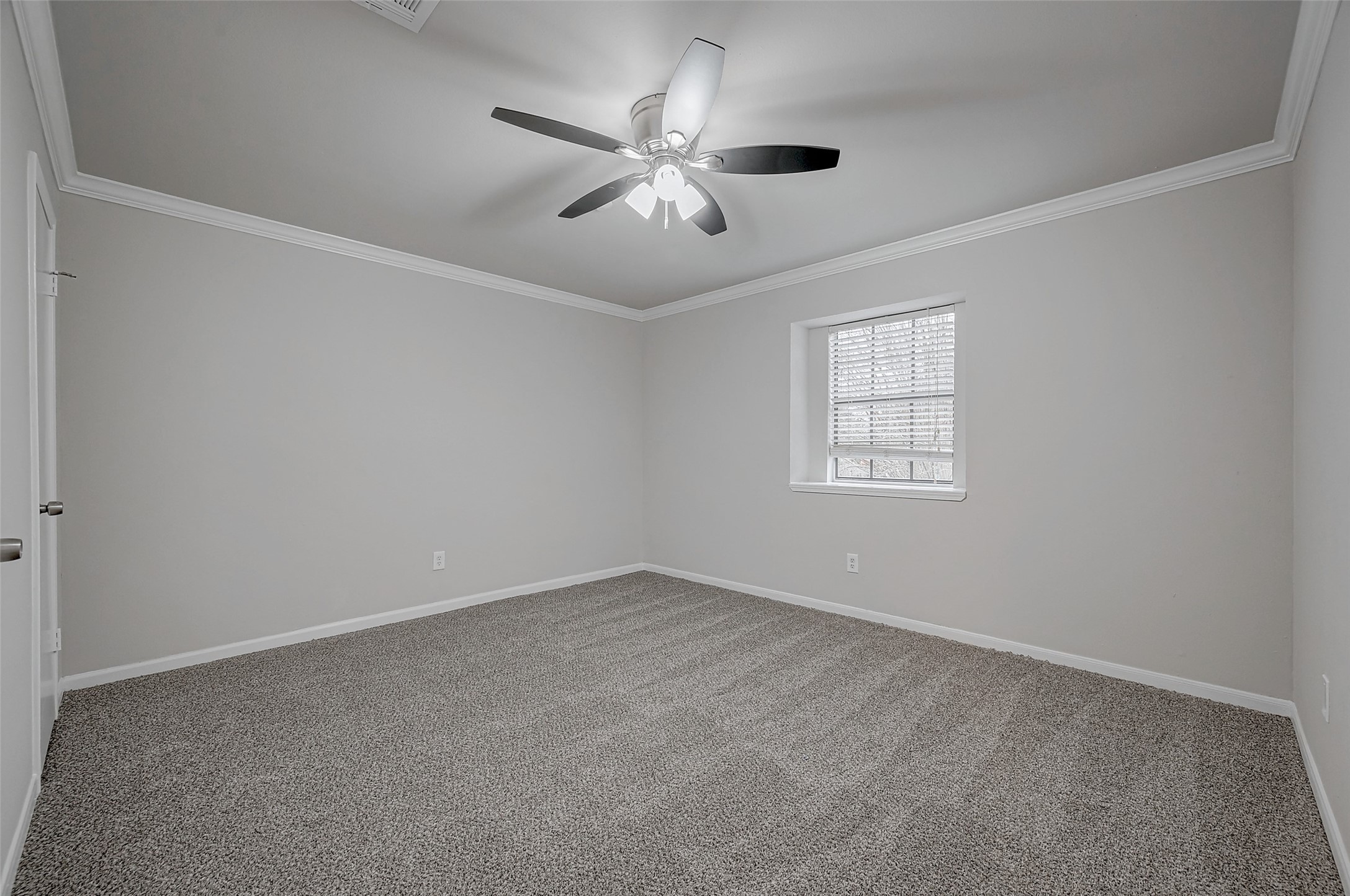 919 Mockingbird Way Sugar Land, TX 77478 - Photo 26 of 41 an empty room with a window and a fan