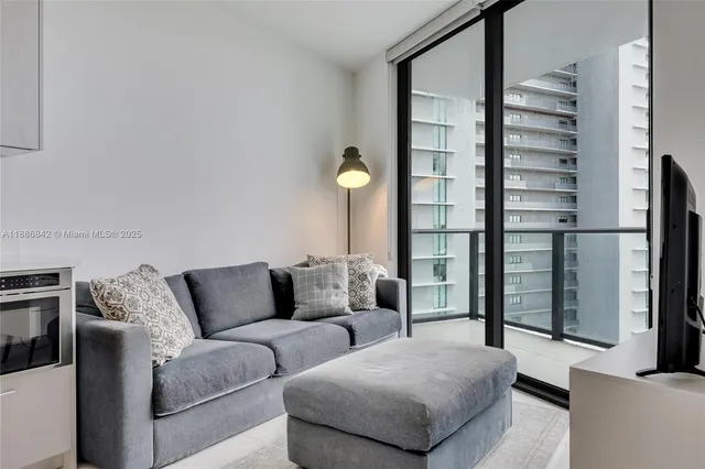 a living room with furniture and a lamp