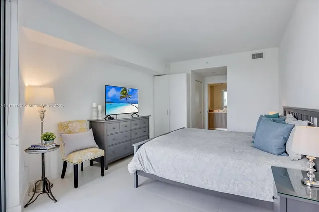 a bedroom with furniture and a bed