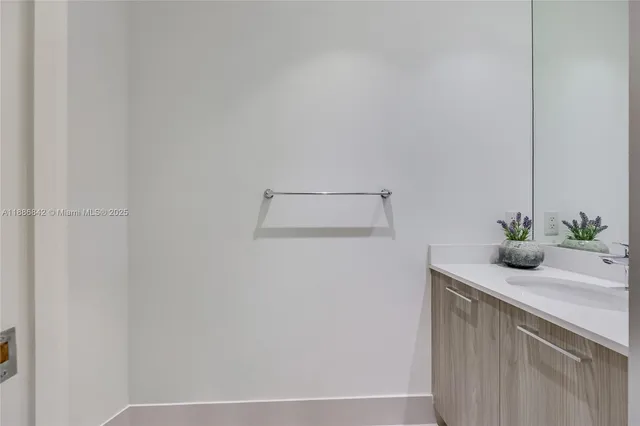 a bathroom with a sink and vanity