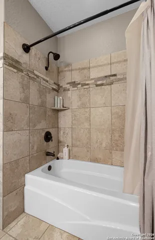 a bathroom with a sink vanity and mirror