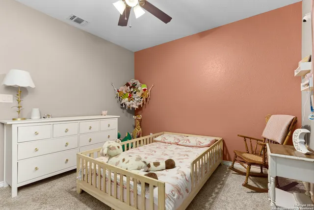 a bedroom with furniture and a window