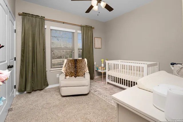 a view of a storage and utility room with washer and dryer