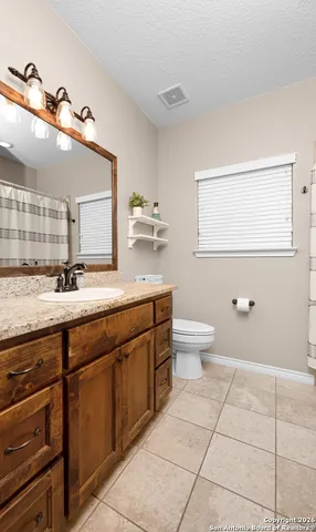 a kitchen with a stove and a sink