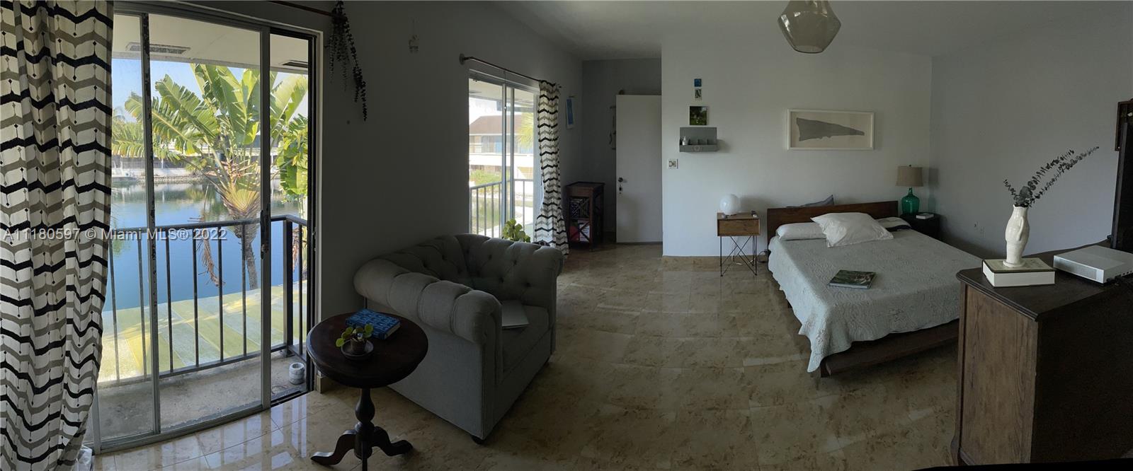 6411 Windmill Gate Road Miami Lakes, FL 33014 - Photo 13 of 23 a bedroom with a small bed and a window