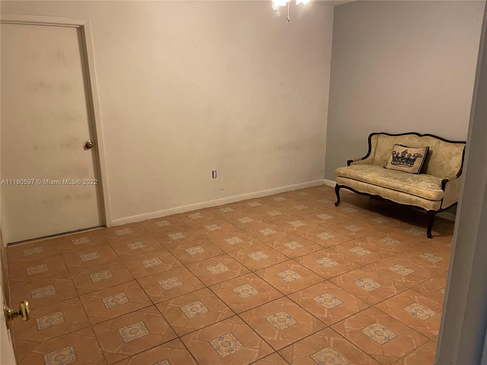 6411 Windmill Gate Road Miami Lakes, FL 33014 - Photo 18 of 23 a view of a room with a bench