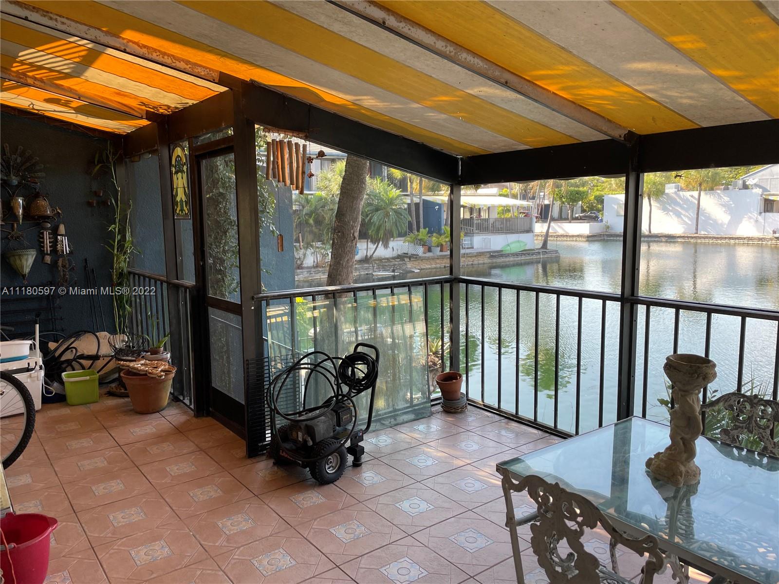6411 Windmill Gate Road Miami Lakes, FL 33014 - Photo 22 of 23 a view of a porch with furniture