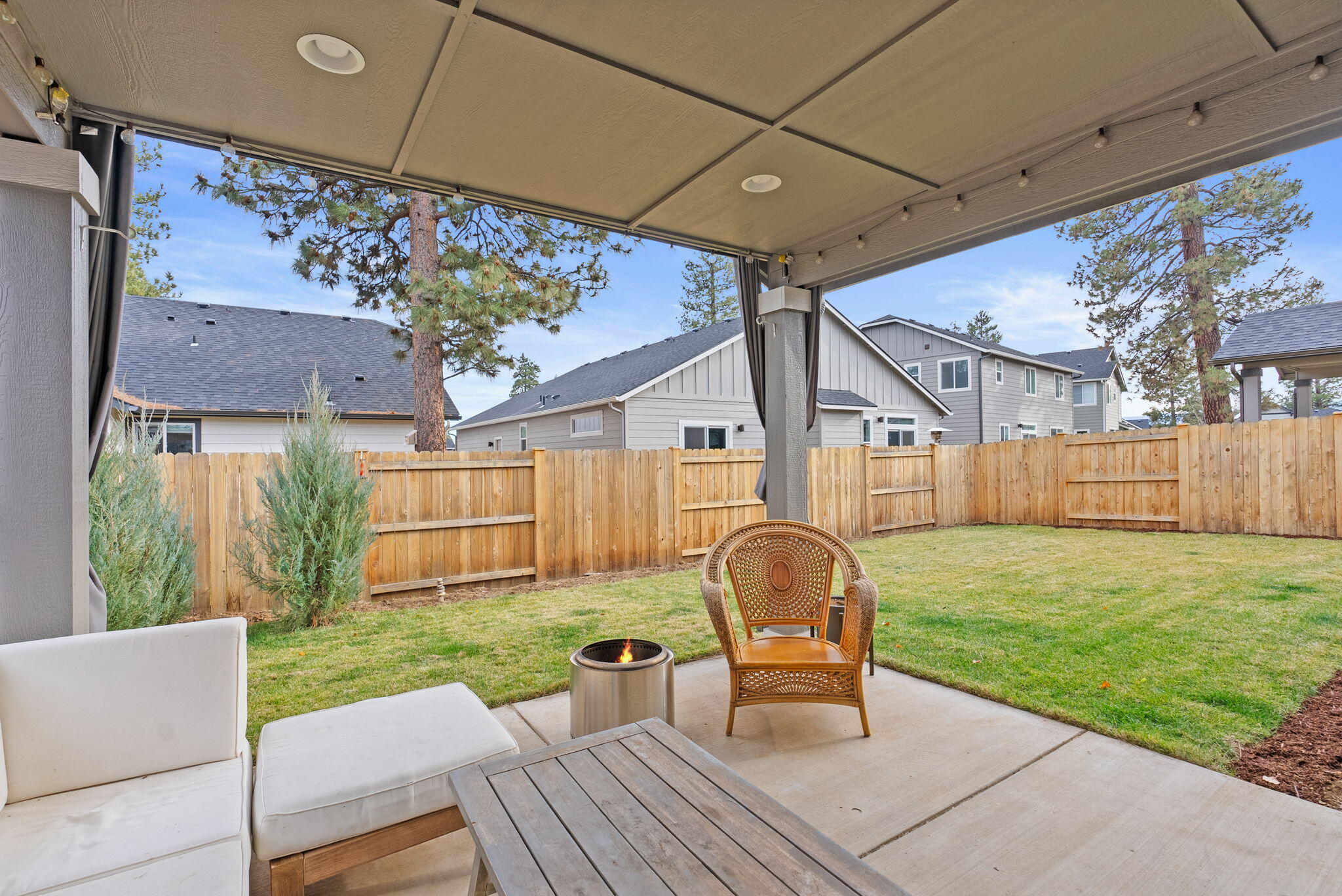 632 North Reed Street Sisters, OR 97759 - Photo 25 of 36 a view of a chair and table in backyard of the house