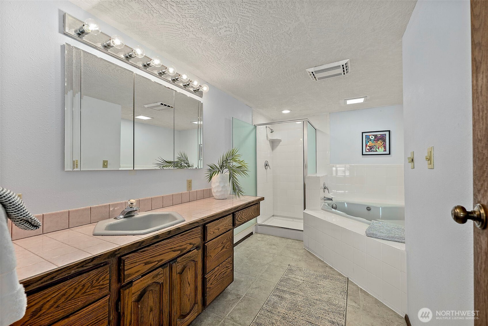 130 East Old Winery Road Shelton, WA 98584 - Photo 14 of 40 a bathroom with a granite countertop sink mirror and bathtub