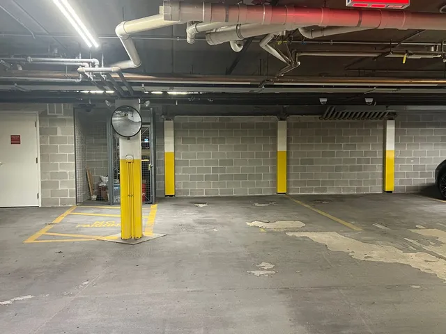 a view of a building with garage