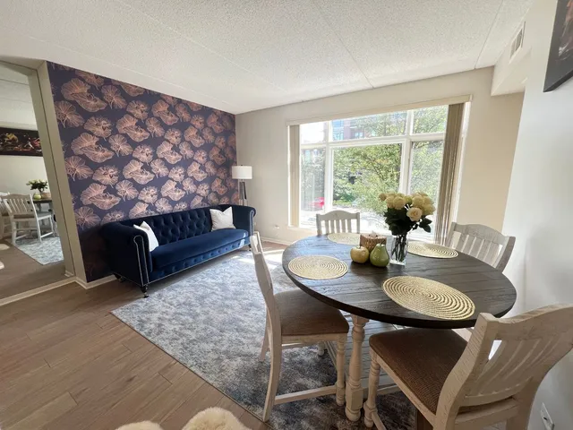 a living room with furniture and a table