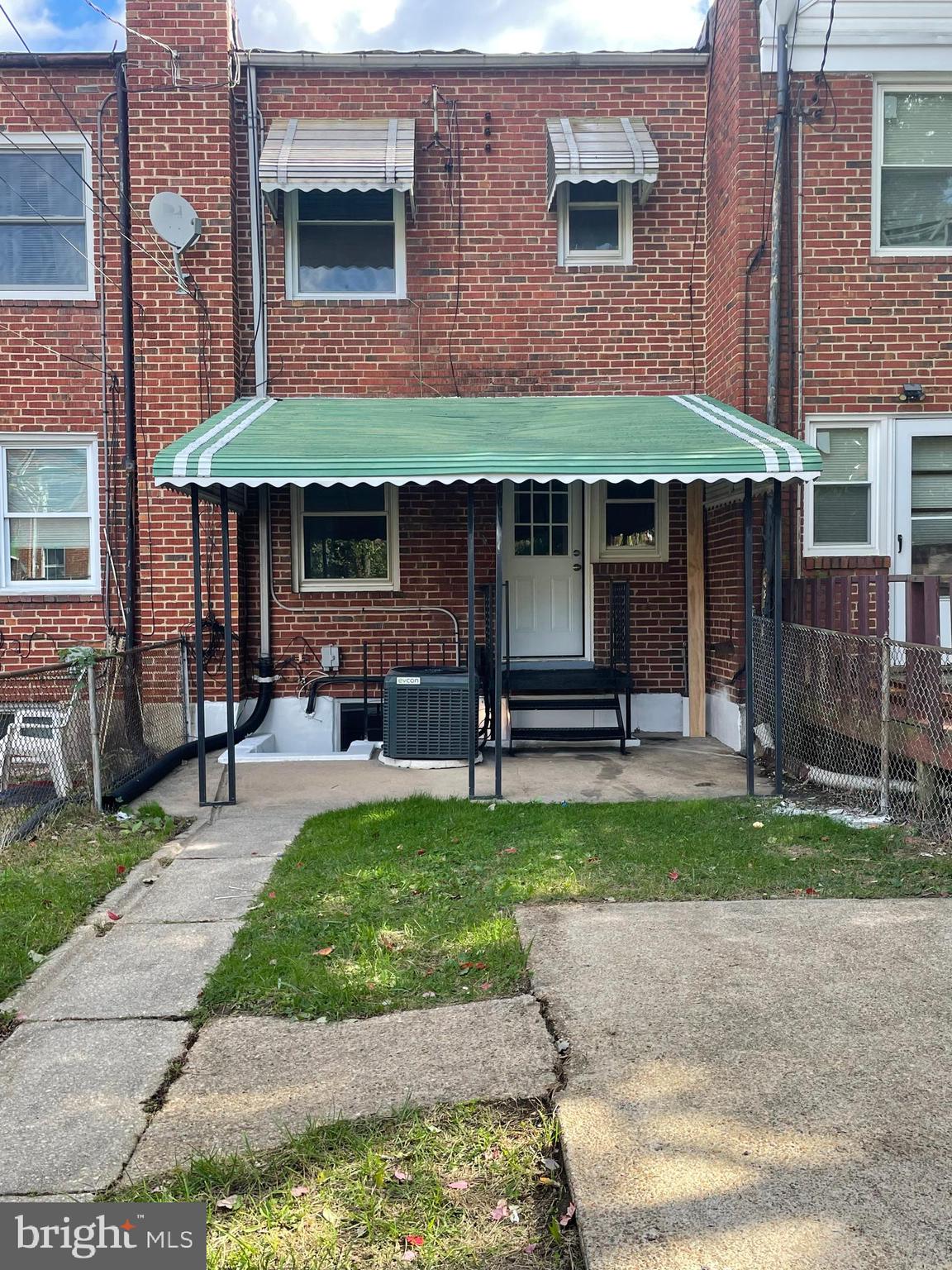 3917 Dudley Avenue Baltimore, MD 21213 - Photo 22 of 23 a front view of a house with a garden