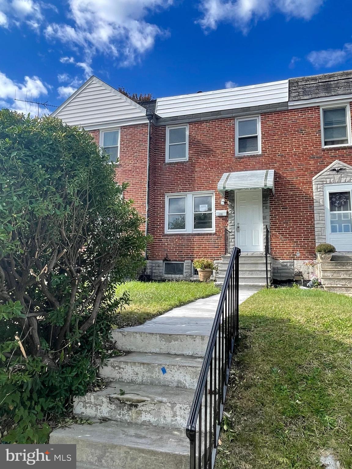 3917 Dudley Avenue Baltimore, MD 21213 - Photo 23 of 23 a front view of a house with garden