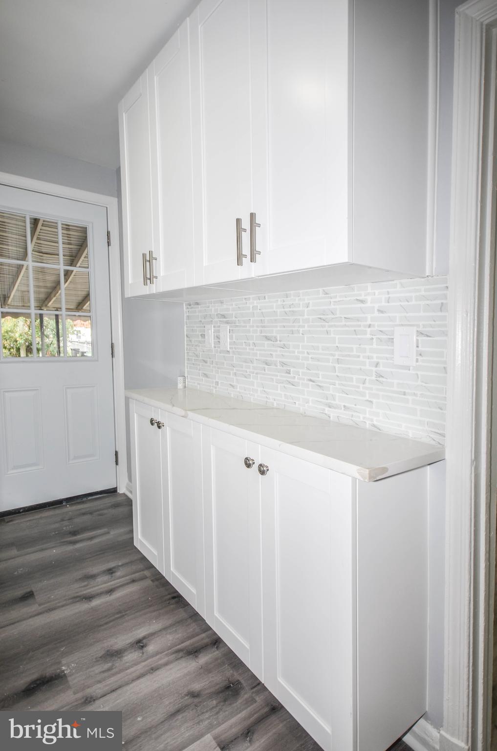 3917 Dudley Avenue Baltimore, MD 21213 - Photo 9 of 23 a bathroom with a sink and a mirror