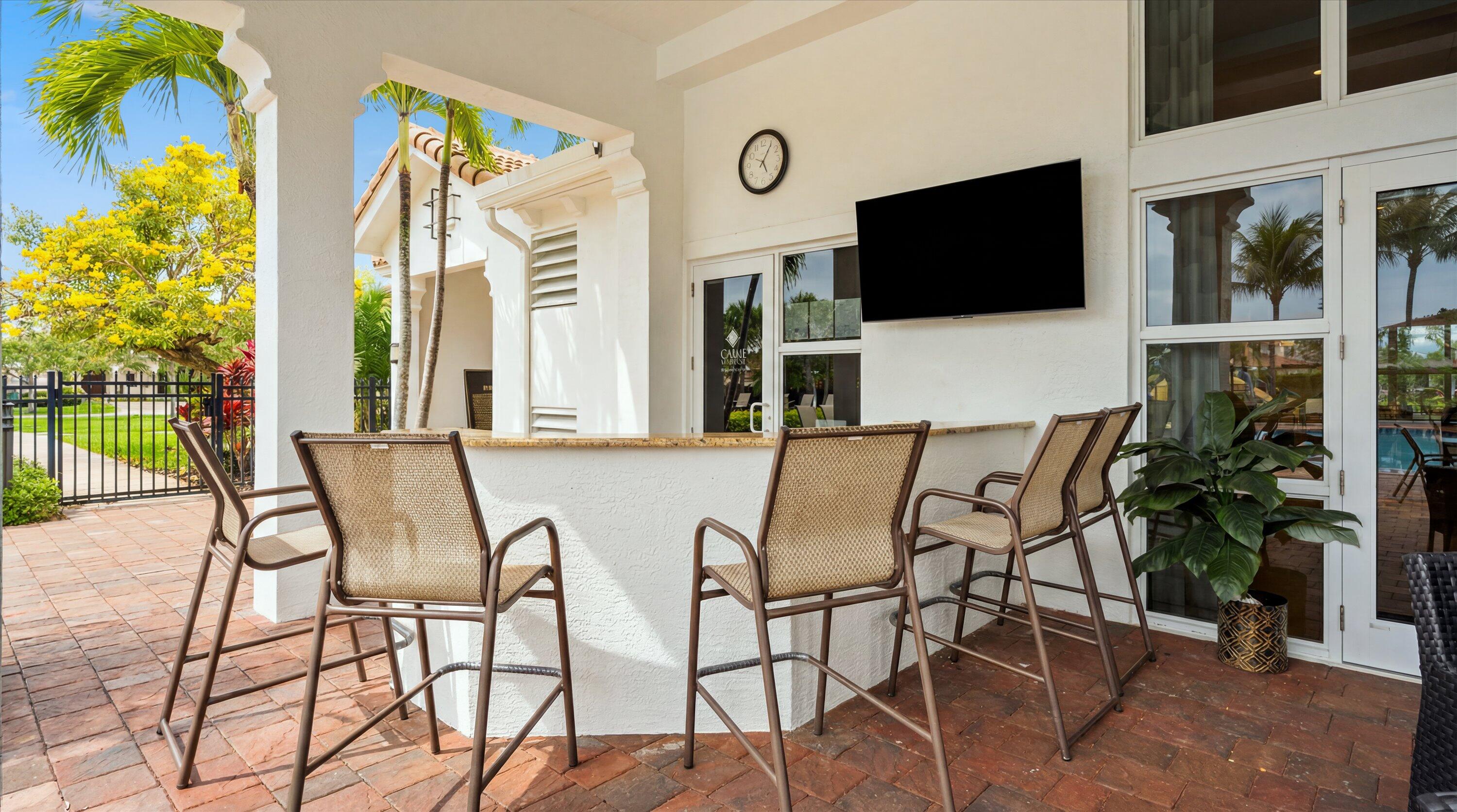 108 Casa Circle Jupiter, FL 33458 - Photo 43 of 53 a view of a dinning room with furniture and flat screen tv