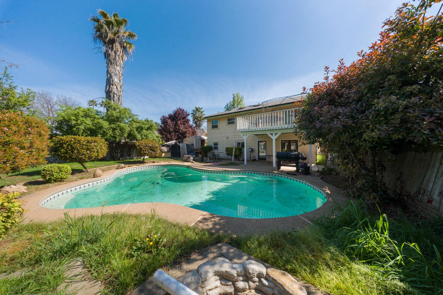 2779 Story Avenue Merced, CA 95340 - Photo 27 of 27 a view of a house with swimming pool and garden