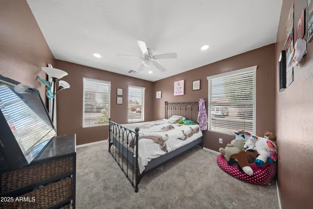 a bathroom with a toilet a sink and a mirror