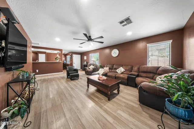 a view of a big room with windows and cabinet