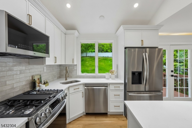 34 Clark Street Summit, NJ 07901 - Photo 11 of 36 a kitchen with a stove a sink and a microwave