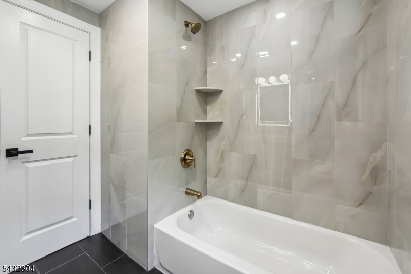 34 Clark Street Summit, NJ 07901 - Photo 20 of 36 a bathroom with a bathtub and shower