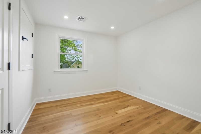 34 Clark Street Summit, NJ 07901 - Photo 23 of 36 a view of room with window and hardwood floor