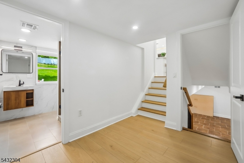 34 Clark Street Summit, NJ 07901 - Photo 25 of 36 a view of a kitchen with furniture and staircase