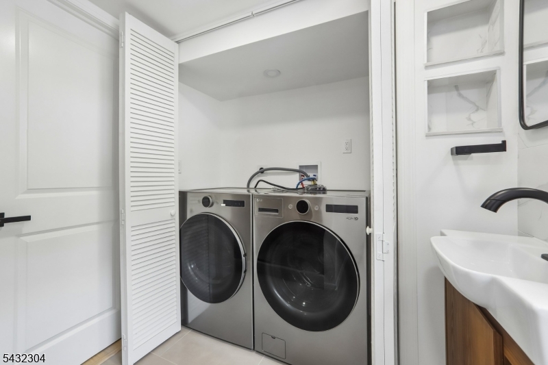 34 Clark Street Summit, NJ 07901 - Photo 29 of 36 a utility room with dryer and washer