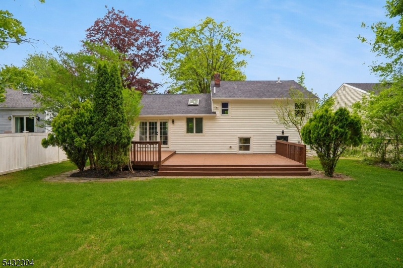 34 Clark Street Summit, NJ 07901 - Photo 36 of 36 a front view of a house with a garden and yard