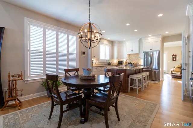 a view of a dining room with furniture window and outside view