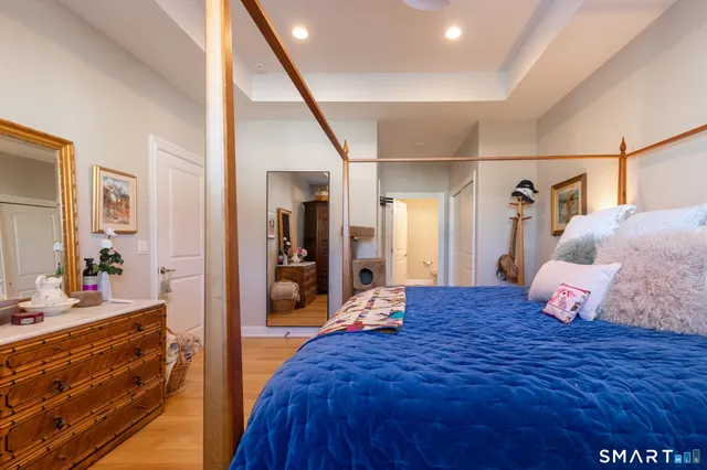 a bed room with a bed and a dresser