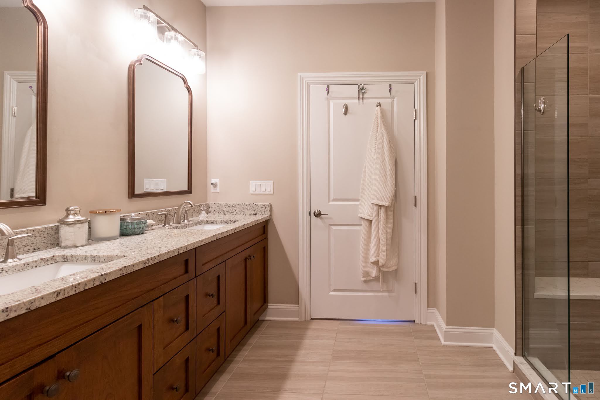 22 Soderman Way Cheshire, CT 06410 - Photo 20 of 40 a spacious bathroom with a double vanity sink a mirror and a shower