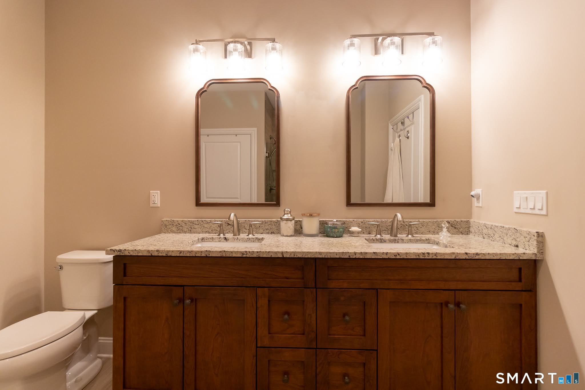 22 Soderman Way Cheshire, CT 06410 - Photo 21 of 40 a bathroom with double vanity sinks and a toilet