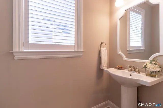 a bathroom with a sink and a window